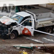 Investigators stand near the wreckage of the Home Depot truck. (AP Photo/Bebeto Matthews)